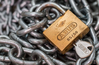 padlock with key on chain to illustrate private keys